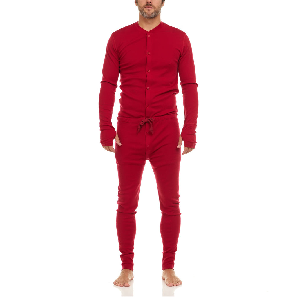 Men wearing a deep red long-sleeve merino wool union suit with crew neckline and button closure.