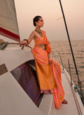 Peach color satin pastel handloom woven saree with a soft sheen