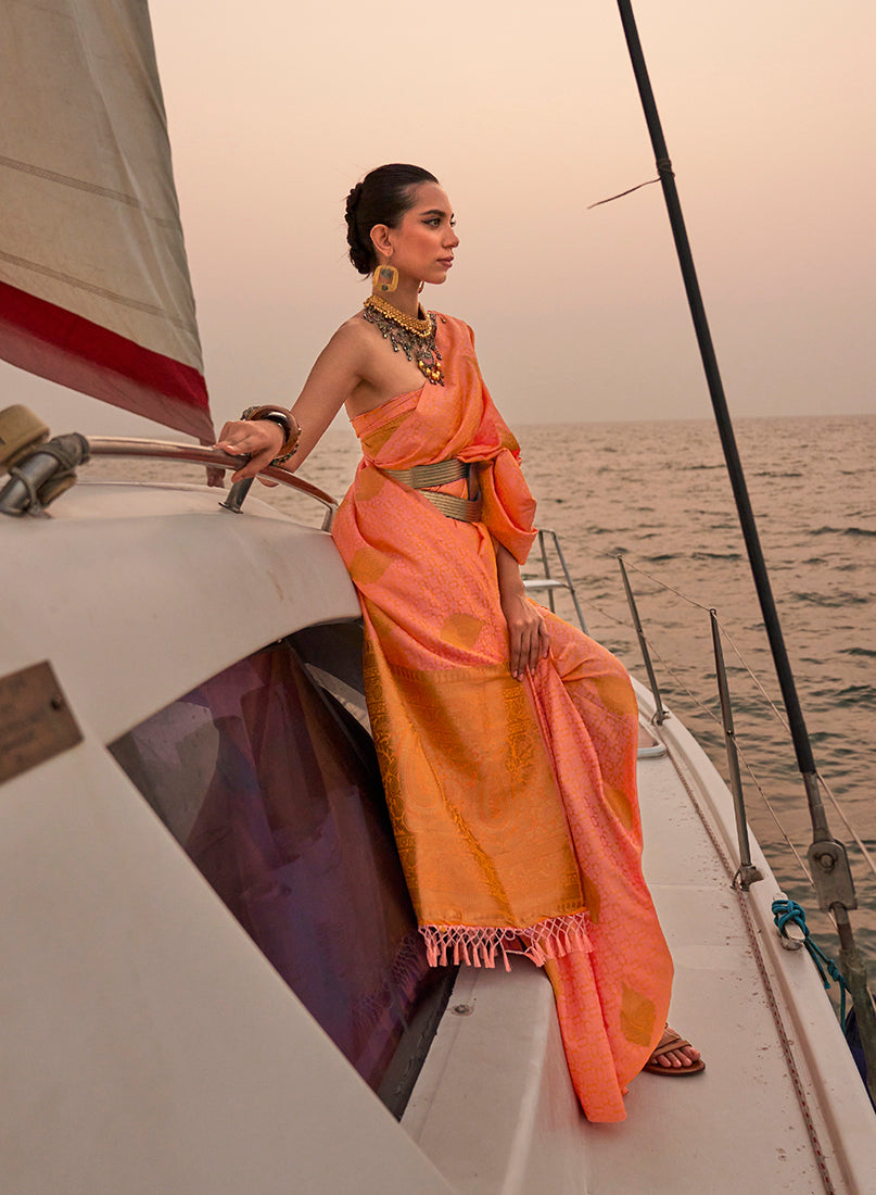 Peach color satin pastel handloom woven saree with a soft sheen