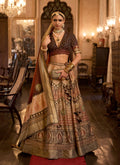 Peach Rajwadi Silk lehenga choli with ethnic prints and sequin embellishments