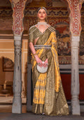 Yellow and Mehendi silk saree featuring Ajarak prints and zari work