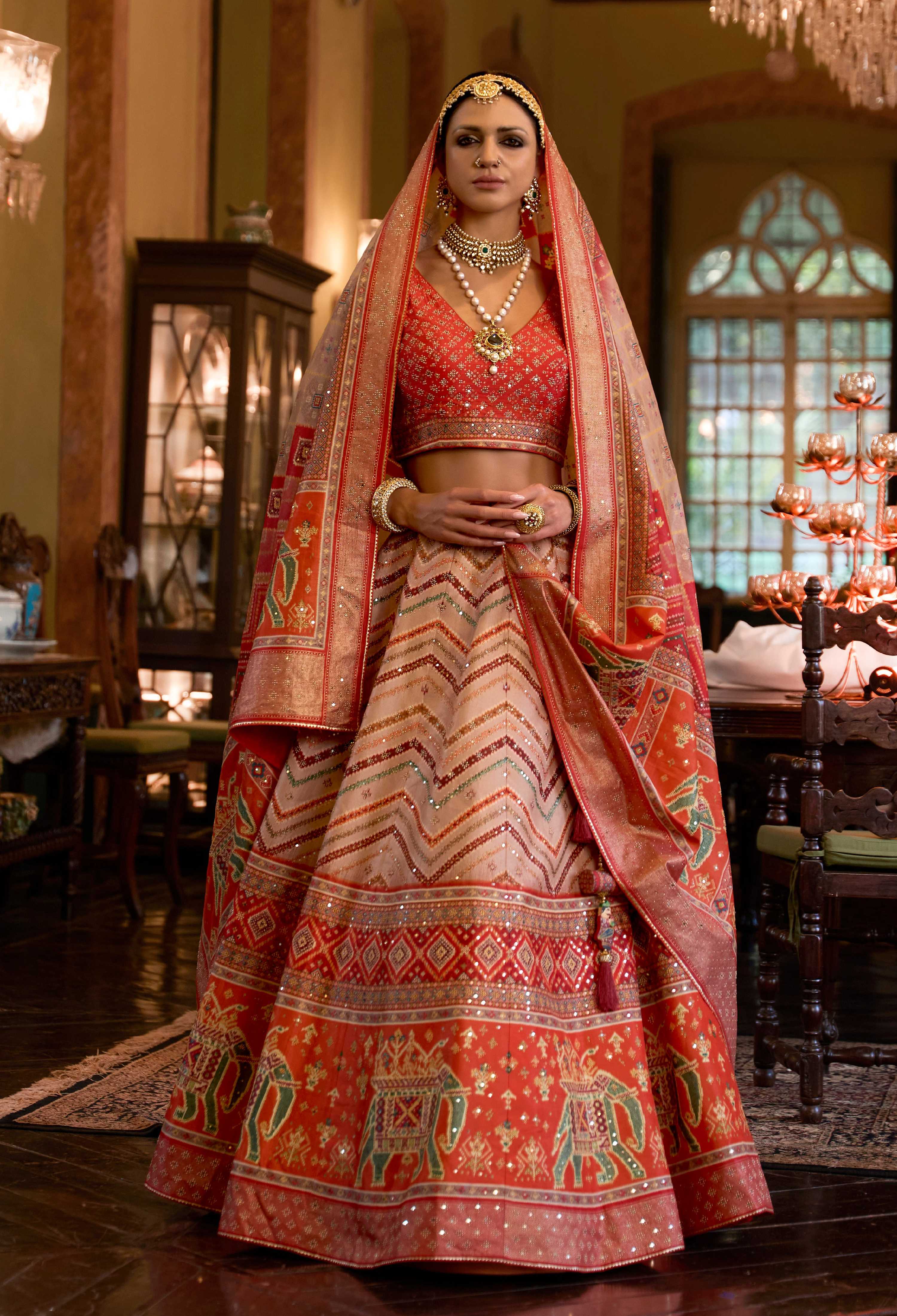 Off white and red Rajwadi silk A-line lehenga choli with intricate embroidery