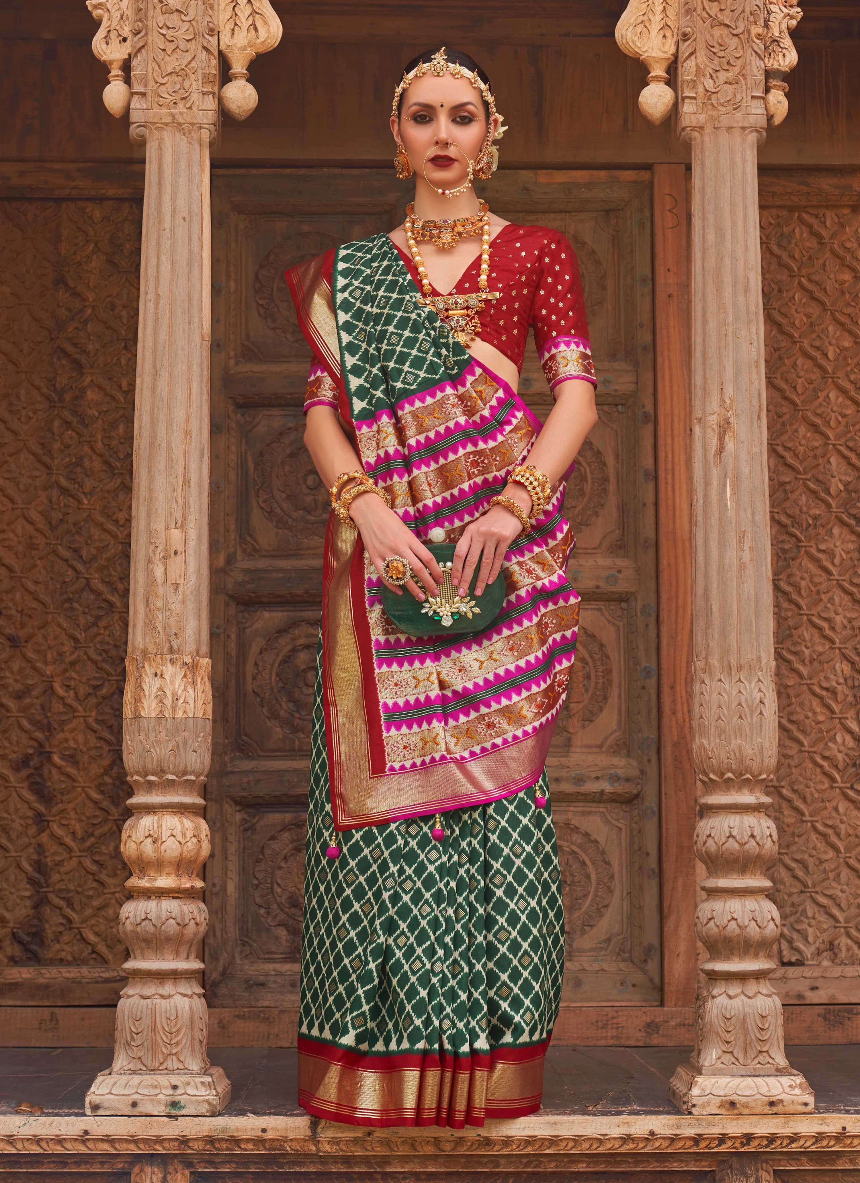 Dark green Patola silk saree with traditional weaving work and blouse piece
