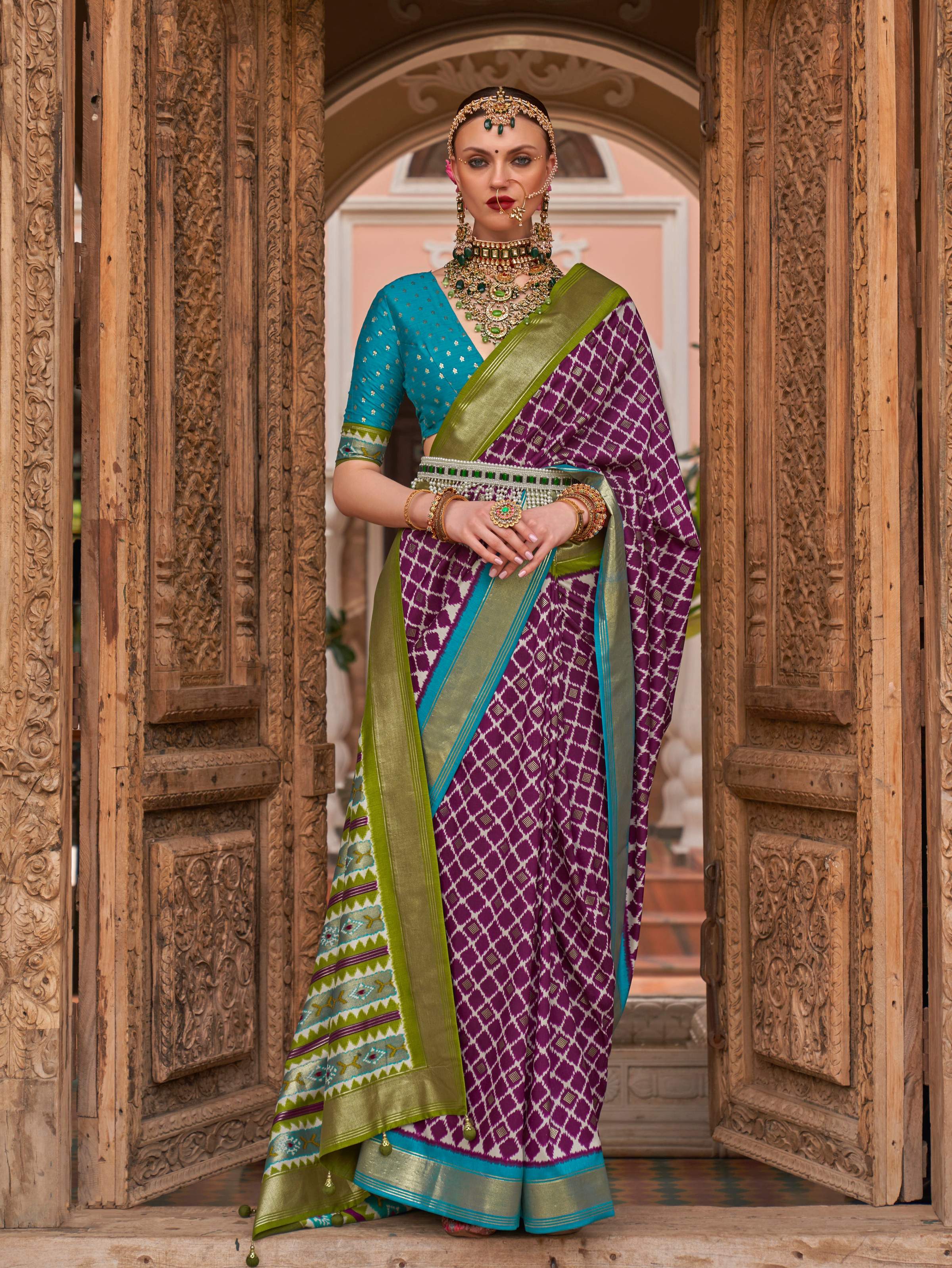 Purple color Patola silk saree with intricate weaving work and blouse