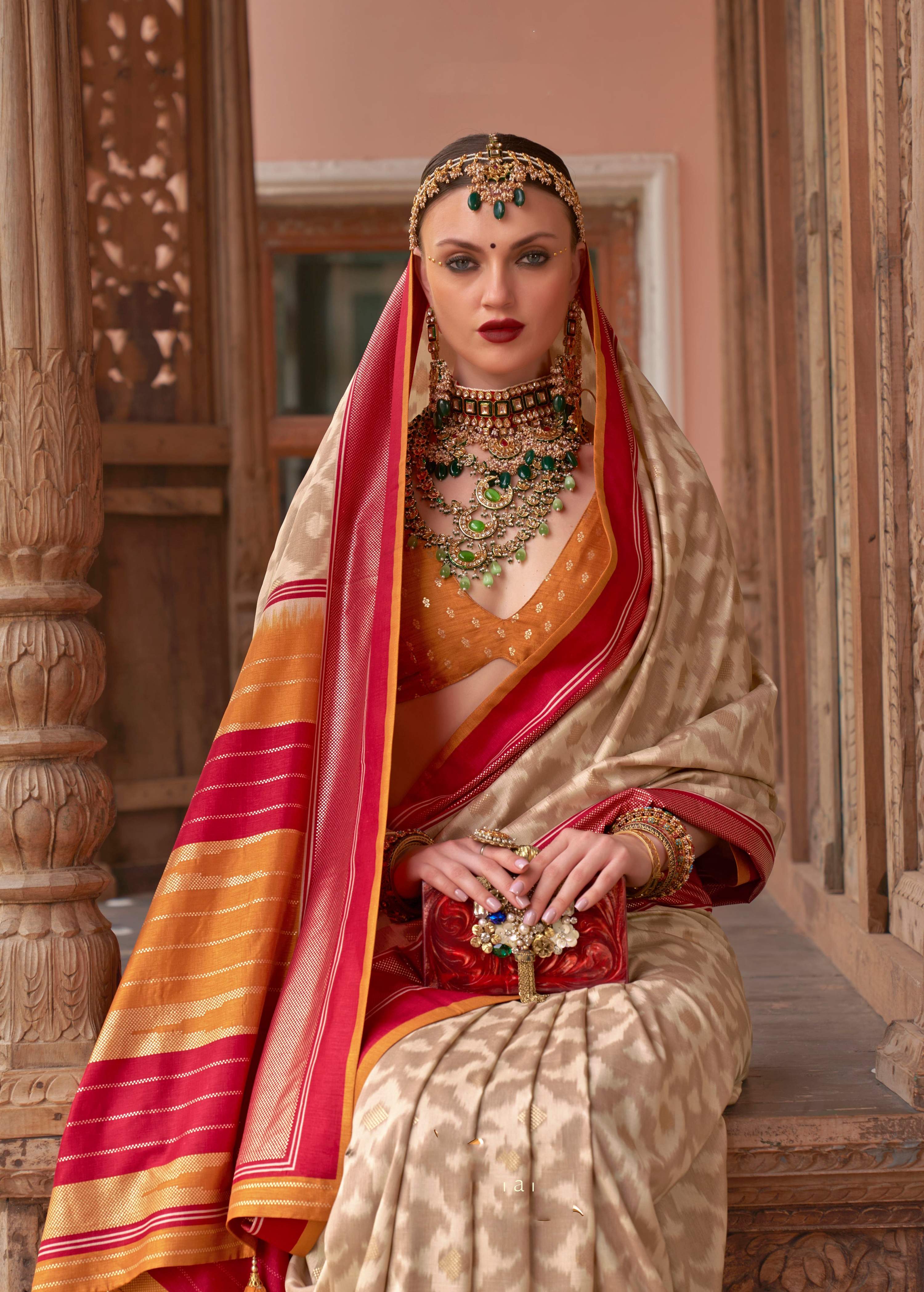 Cream Patola Silk Saree with Elegant Weaving Work