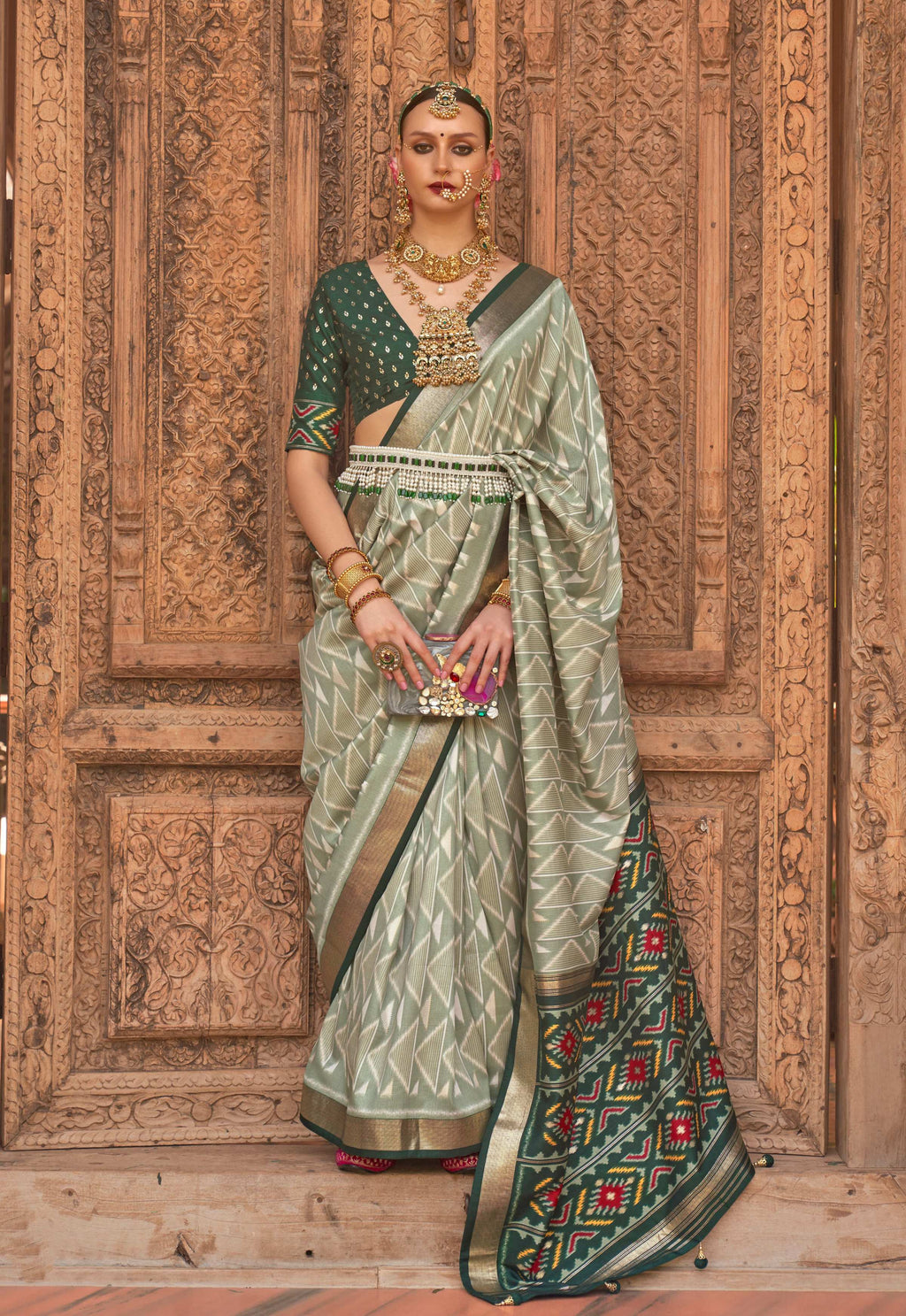 Light green Patola silk saree with traditional weaving and blouse