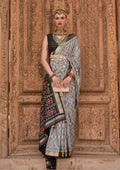 Light grey Patola silk saree with weaving work and matching blouse