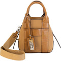 Tan pebbled leather Sequoia mini satchel with structured top handles on a minimalist background