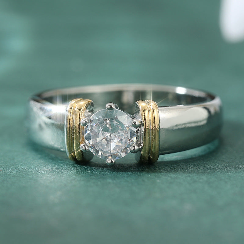 Bohemian two-tone round zircon ring on a finger, featuring eco-friendly copper construction.