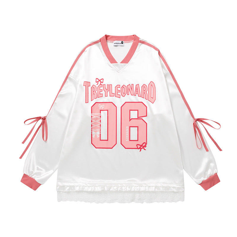 White and pink V-neck long sleeve t-shirt with 'TREYLEONARD 06' print, pink sleeve ties, and lace hem.