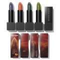 Collection of four matte lipsticks in moody colors with horror-themed packaging featuring a ghostly graveyard scene