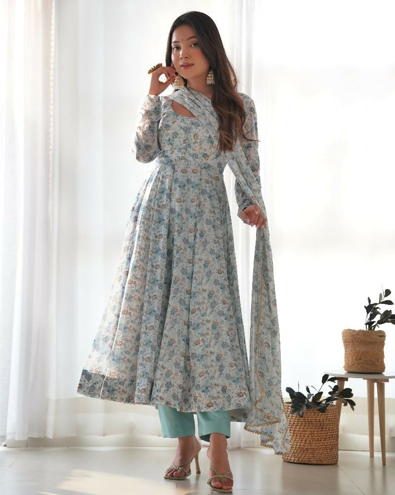 A sky-colored organza kurta set with detailed sequin embroidery paired with matching cotton trousers.