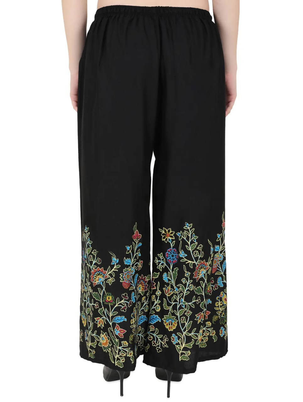 Black palazzo pants featuring a subtle floral pattern