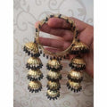 Gold-tone bangles with black pearls and hanging jhumka charms