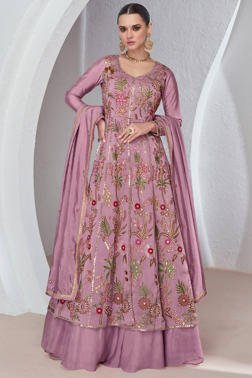 A pink viscose silk embroidered gown and skirt set with a lace-trimmed faux georgette dupatta.
