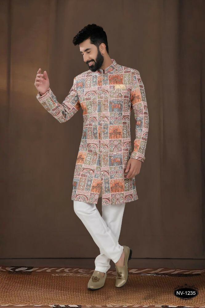Baby boy wearing a pink georgette kurta with intricate thread and sequence embroidery