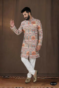 Baby boy wearing a pink georgette kurta with intricate thread and sequence embroidery