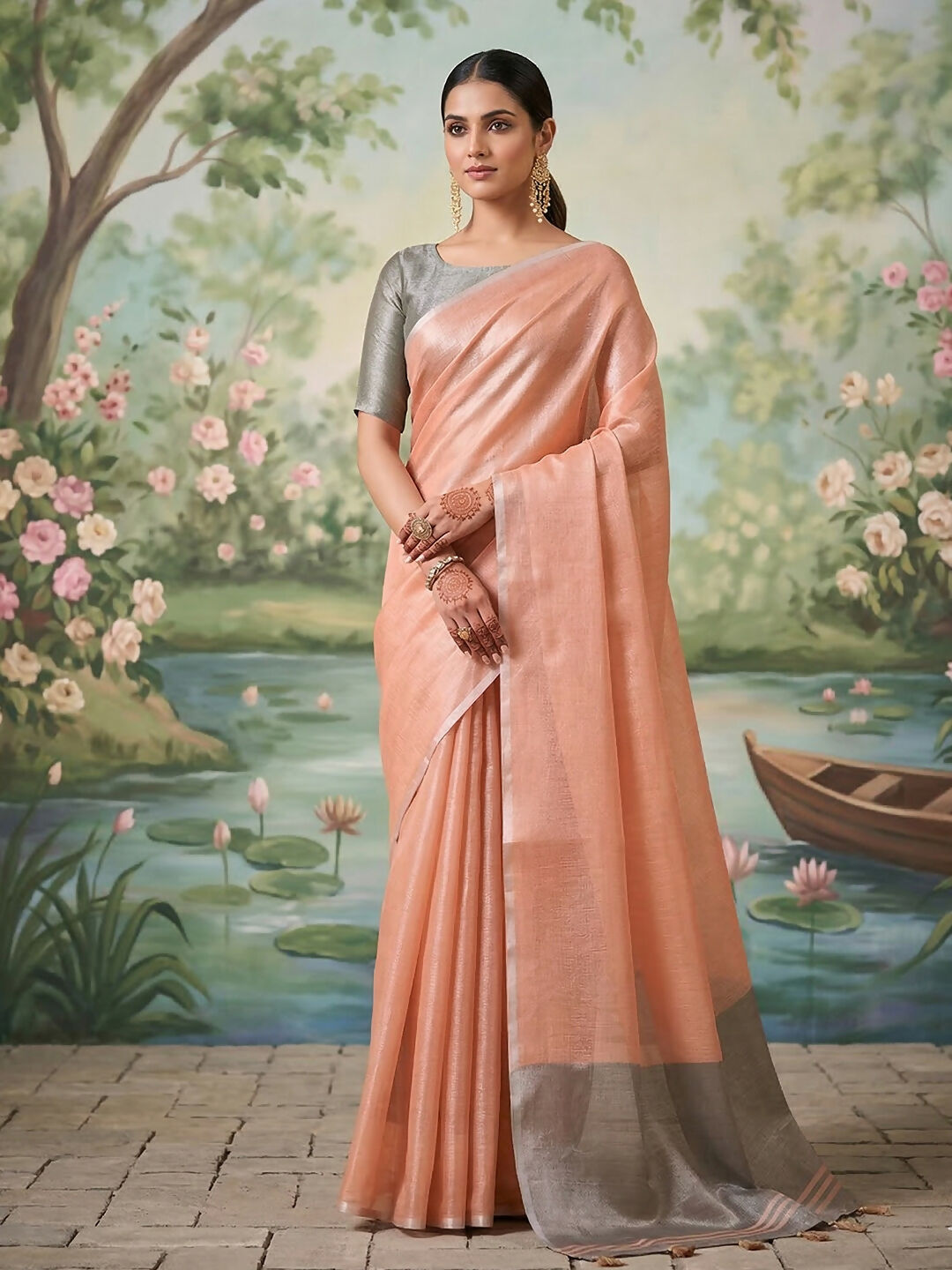 Shimmering peach tissue silk saree with matching blouse material