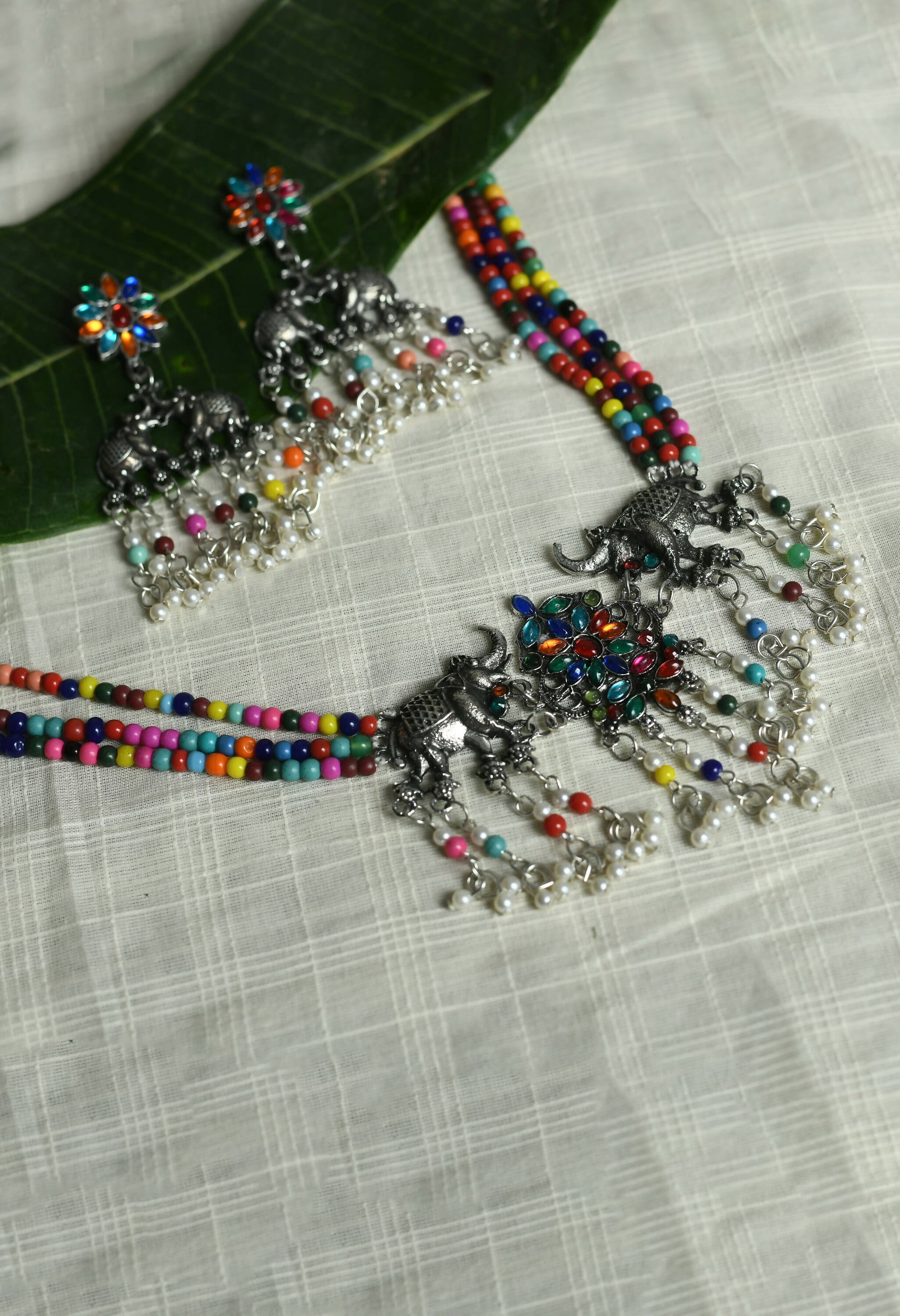 Multi-colored elephant design choker with silver-plated finish
