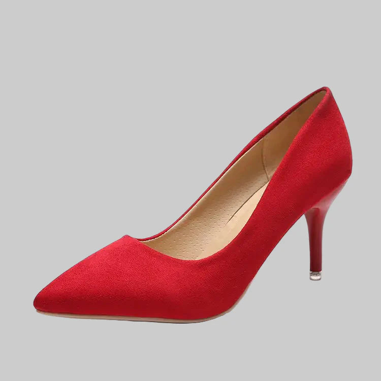 A pair of women's pointed-toe slim stiletto pumps in red and tan suede finishes.