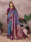 A beautiful grey Kalamkari silk saree with intricate Zari weaving and a contrasting purple blouse piece.