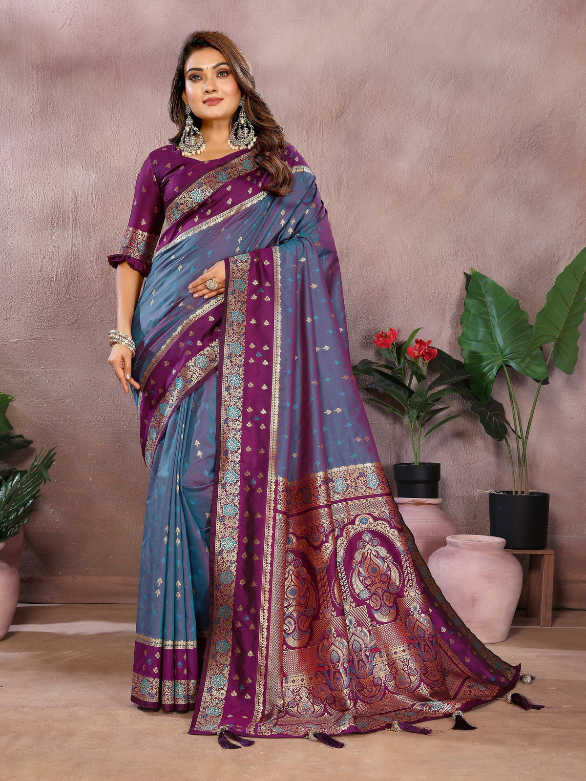 A beautiful grey Kalamkari silk saree with intricate Zari weaving and a contrasting purple blouse piece.