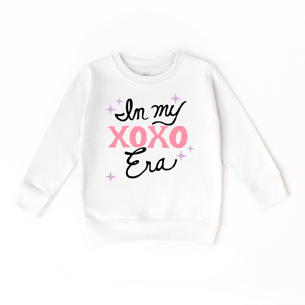 In my XOXO Era Sweater