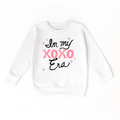 In my XOXO Era Sweater