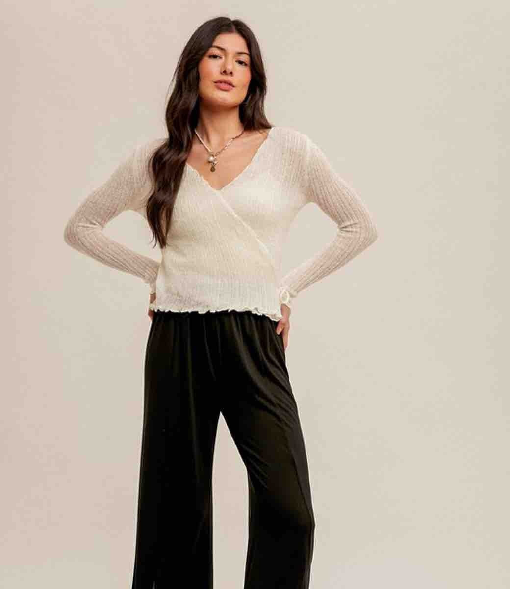 Off White pointelle knit sweater top with a front tie waist detail