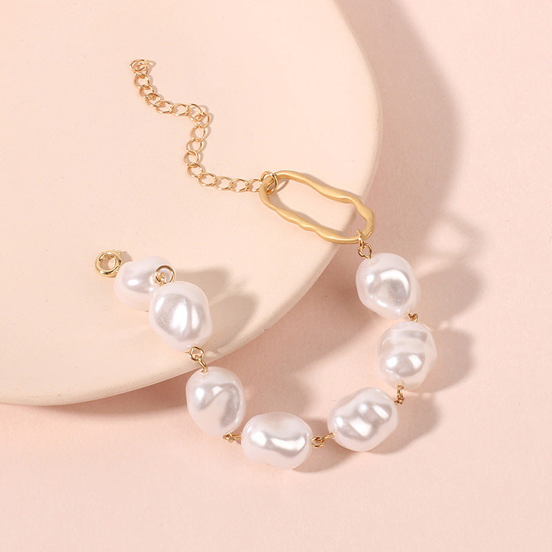 Four-Row Pearl Link Chain Bracelet in Gold-Tone Metal