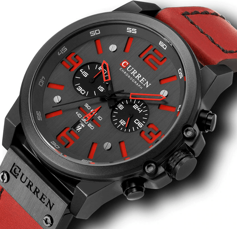 Retro-style chronograph watch with a silver steel case and dark leather strap on a clean background.
