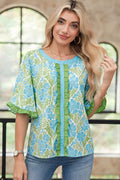 Waverly half-sleeve floral blouse with color-block trim in blue and green.