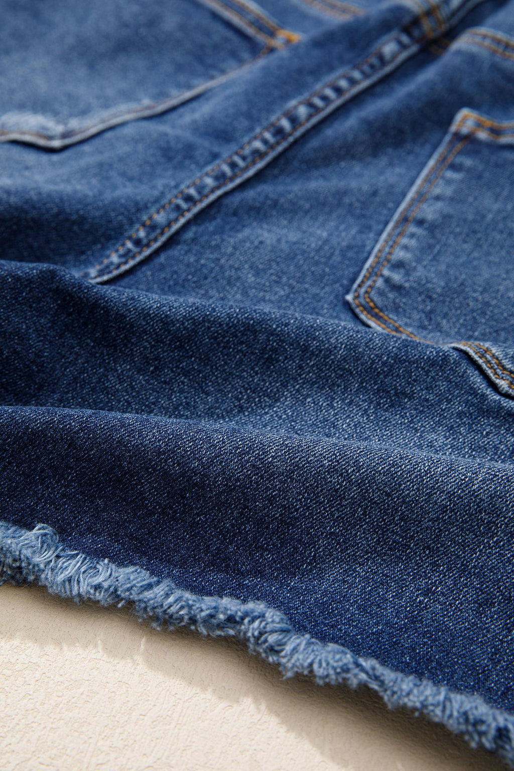 High-Waist Distressed Denim Asymmetric Raw Hem Shorts in Blue