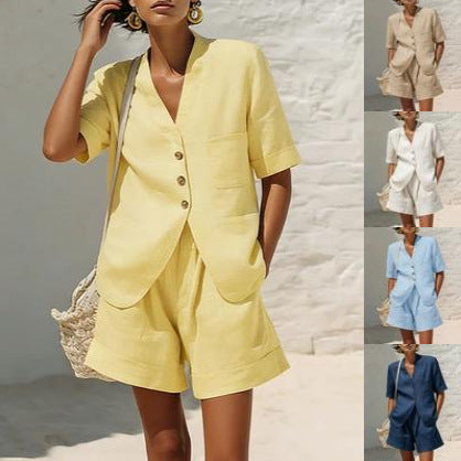 A woman wearing a light blue cotton-linen button-down shirt and matching relaxed shorts set.