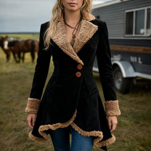 A woman wearing a black winter coat with faux fur lining and trim, viewed from the front, paired with jeans.