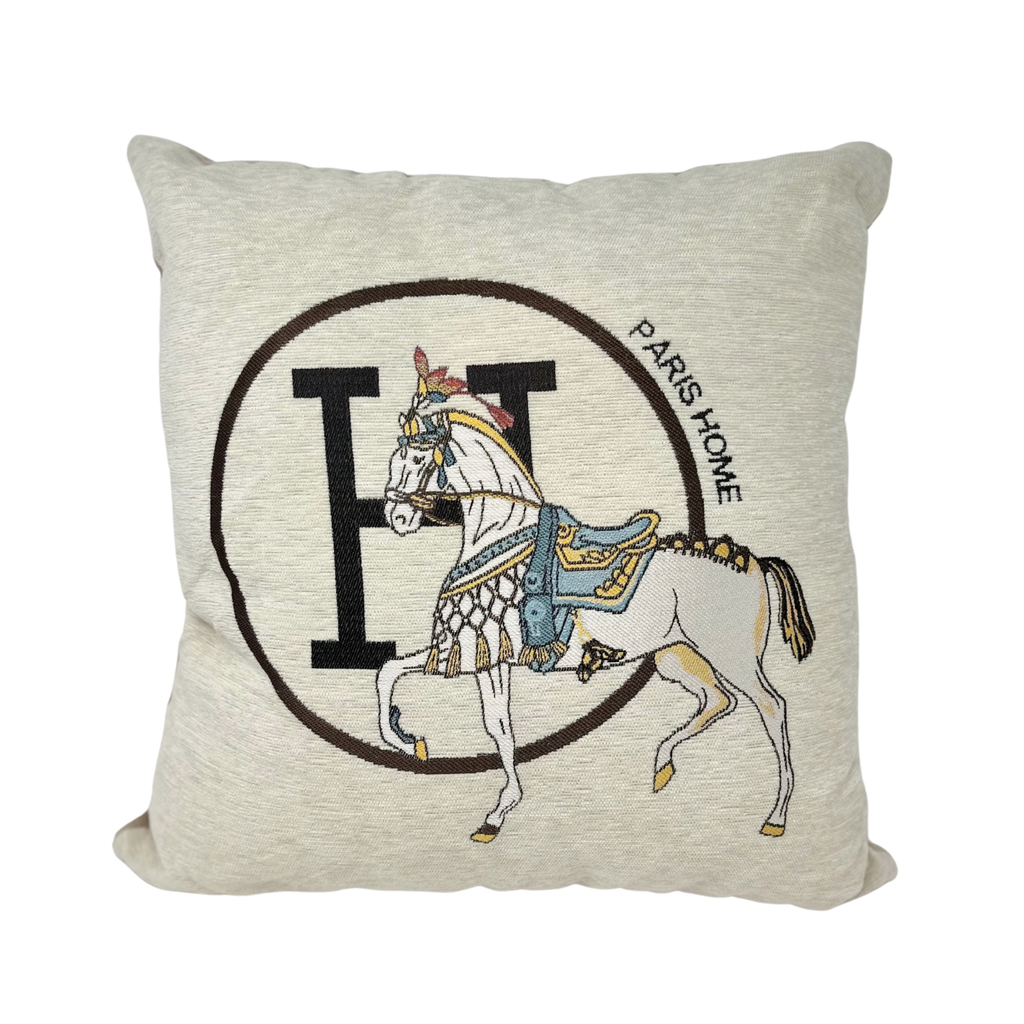 Decorative 18x18 ivory pillow cover featuring an elegant horse motif on a neutral fabric background.