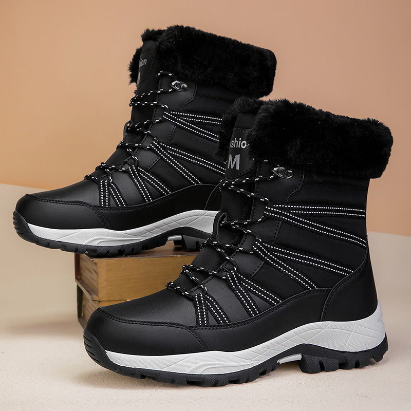 A pair of black women's winter fleece-lined mid-boots featuring a thick white non-slip sole and lace-up front detail