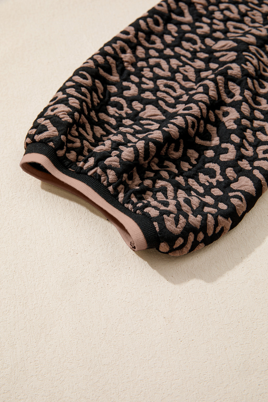 Leopard print fabric on a beige background