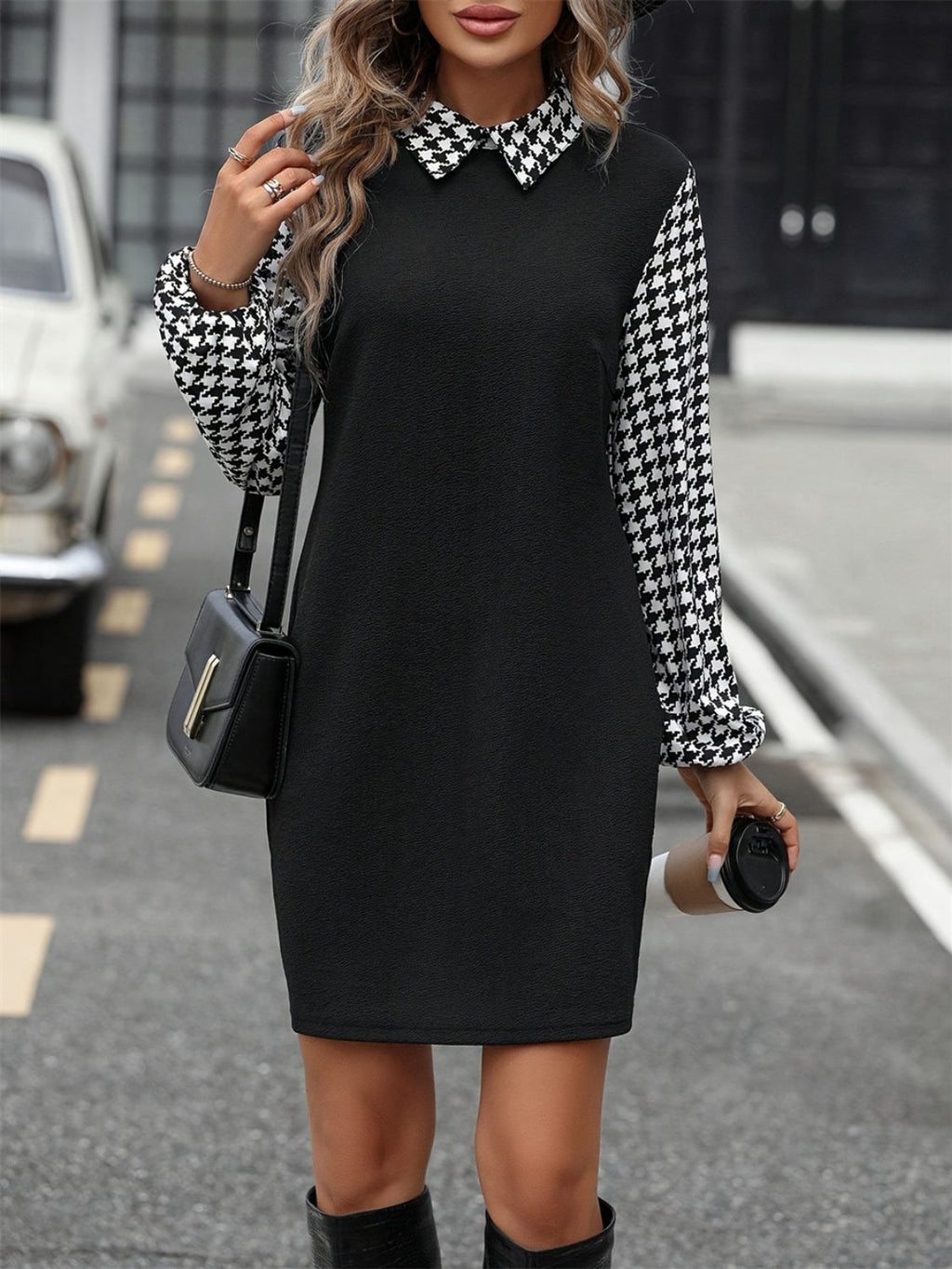 Woman wearing a vintage-inspired black and white collared mini dress.