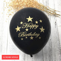 A colorful assortment of 10-inch luxury latex balloons in black, gold, orange, pink, and white for party decoration.