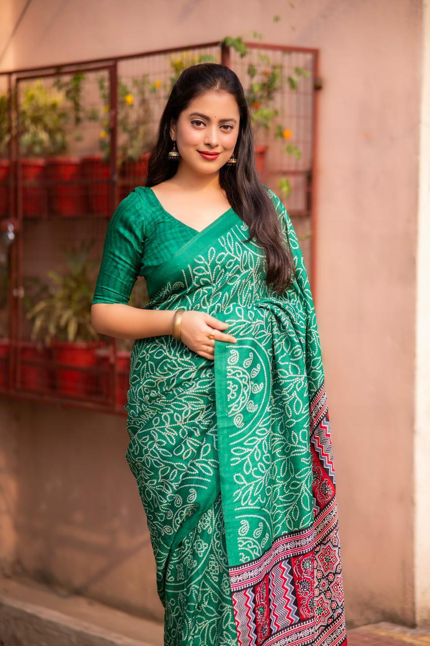 Green silk blend saree with Ajrakh pallu and bhandi prints