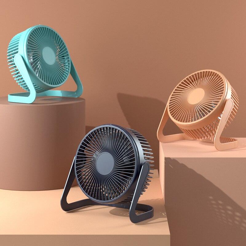 Modern 5-inch minimalist desktop fan in pastel tones sitting on a clean office desk.