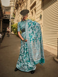 Sky blue Lakhnavi organza saree with intricate weaving work and matching blouse