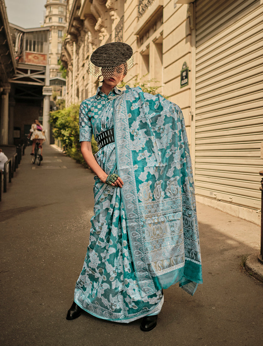 Sky blue Lakhnavi organza saree with intricate weaving work and matching blouse