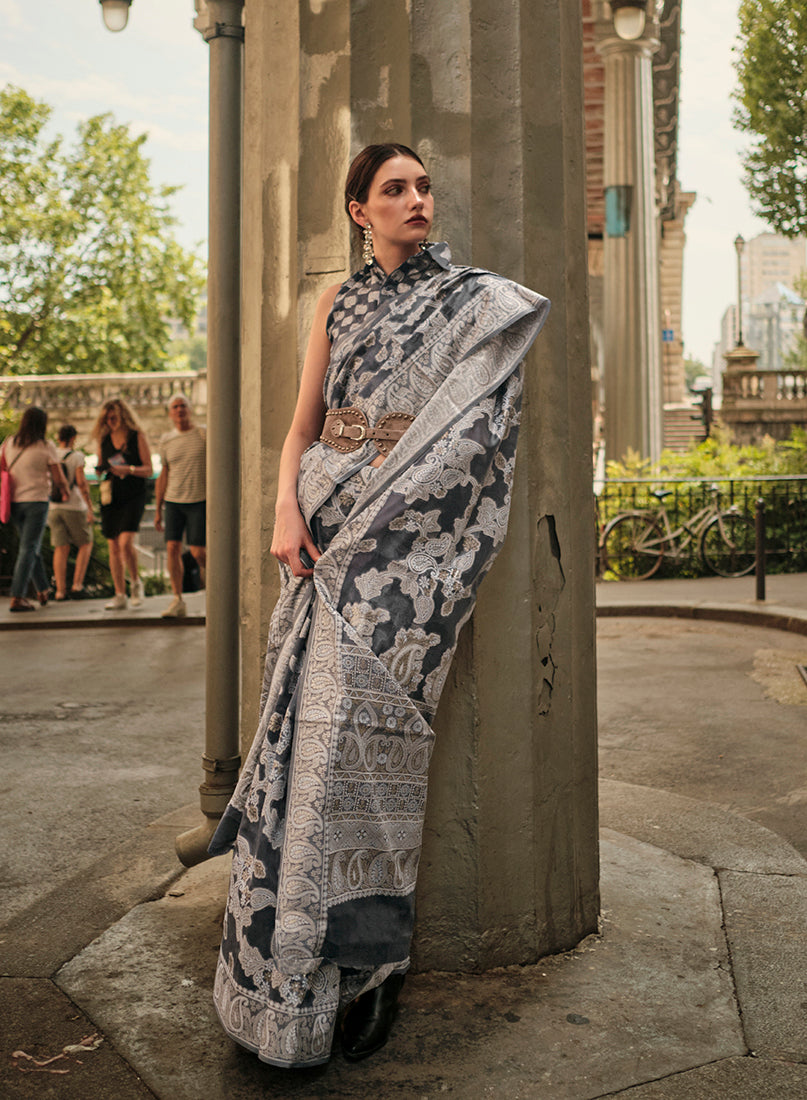 Sophisticated black Lakhnavi organza saree with delicate weaving work.