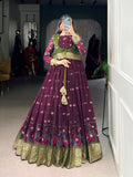 Wine poly-cotton gown with Kalamkari print and zari weaving border, paired with matching Koti.