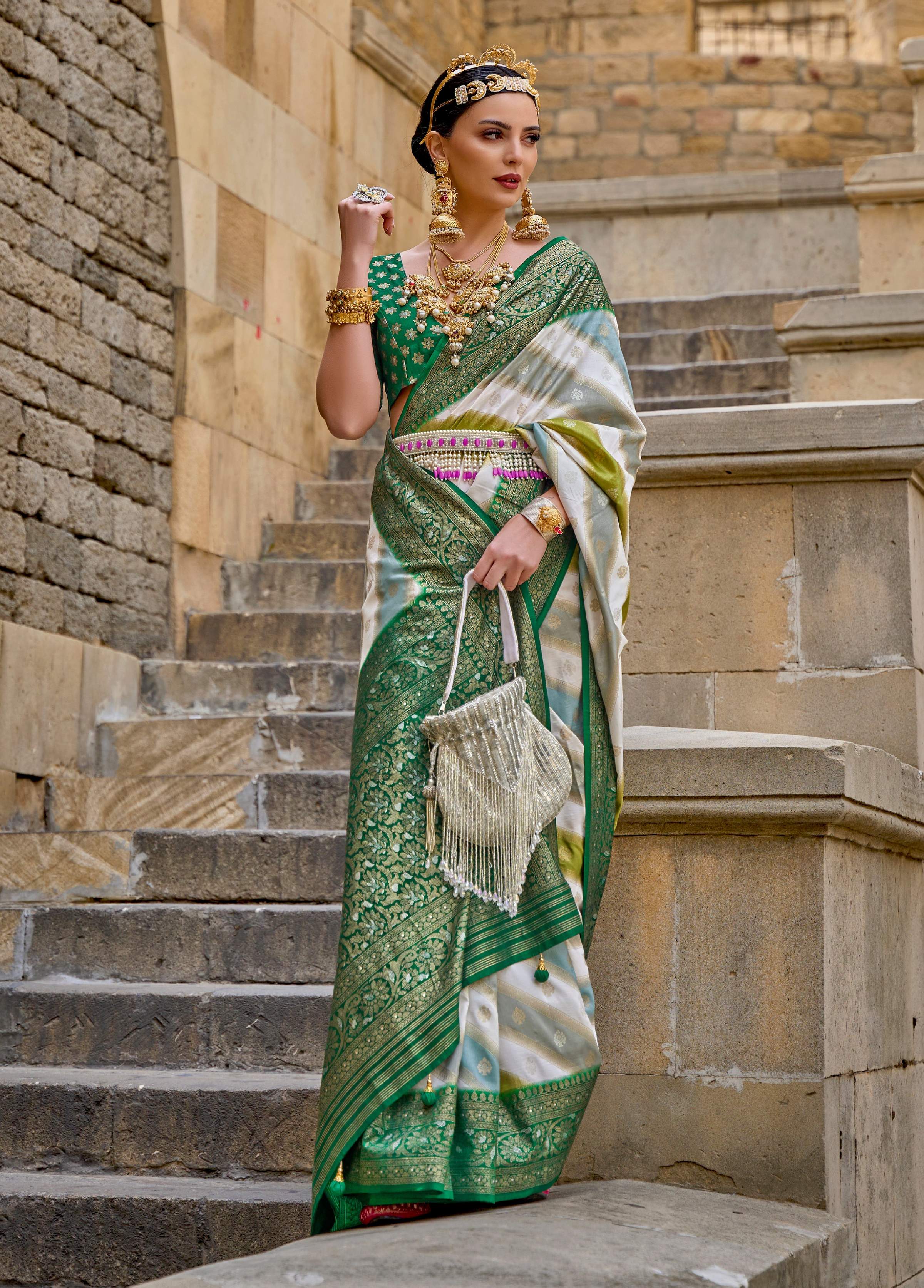 Green silk saree with intricate geometric woven border and matching blouse