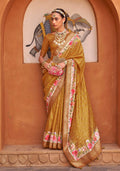 Amber color digitally printed silk saree featuring a floral pattern with an included blouse piece.