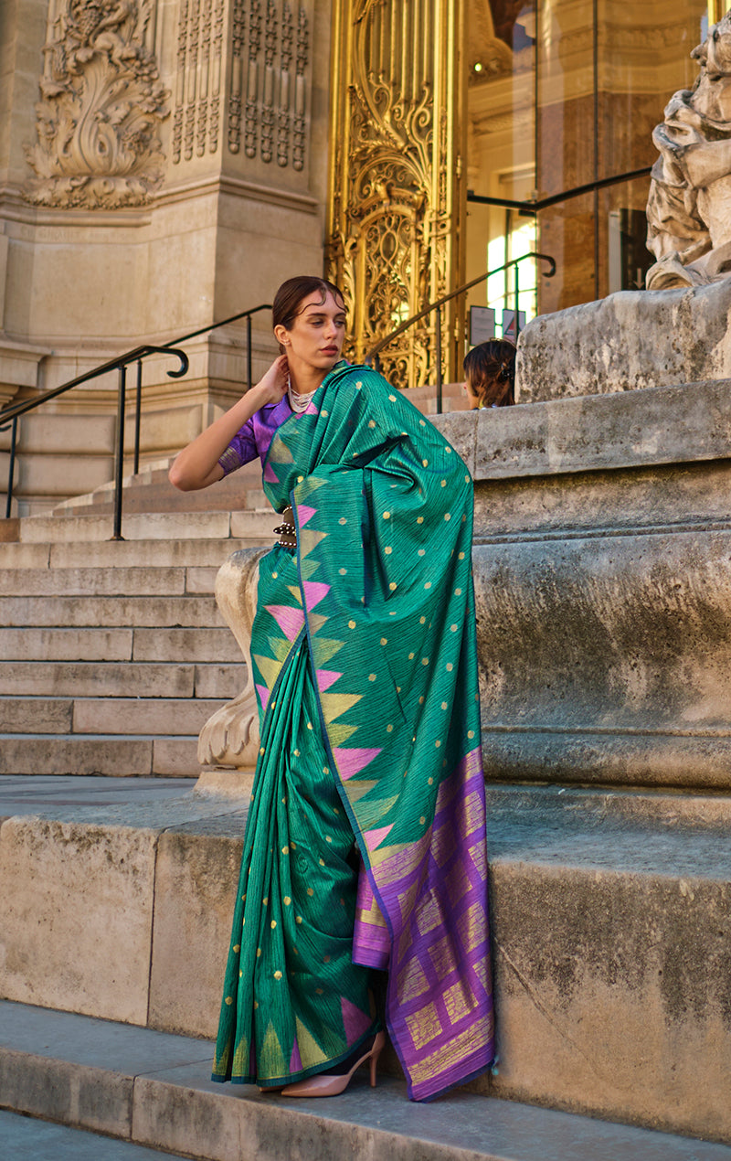 Elegant teal woven silk traditional saree with ethnic weaving details