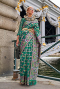 Model wearing a Teal Embellished Organza Contemporary Saree with intricate detailing.